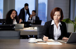 businesswoman-working-with-document-office