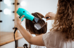 female-hairdresser-making-hairstyle-brunette-woman-beauty-salon